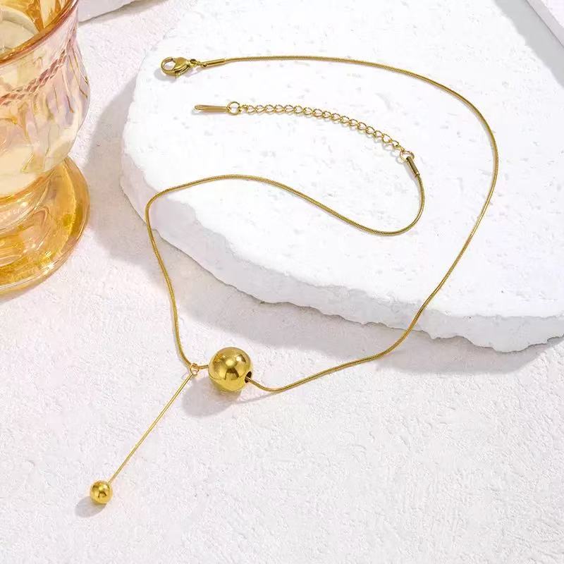 Golden Sphere Balance Necklace