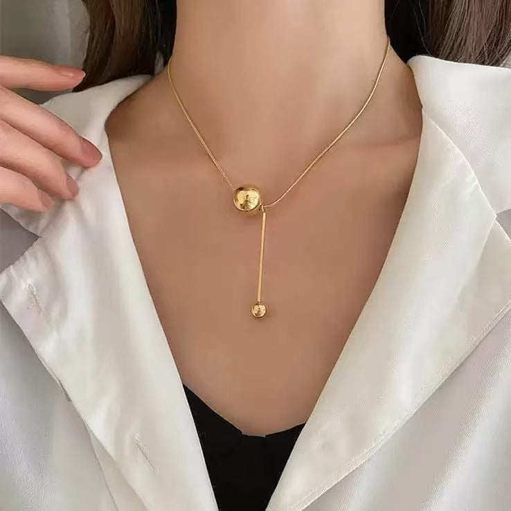 Golden Sphere Balance Necklace